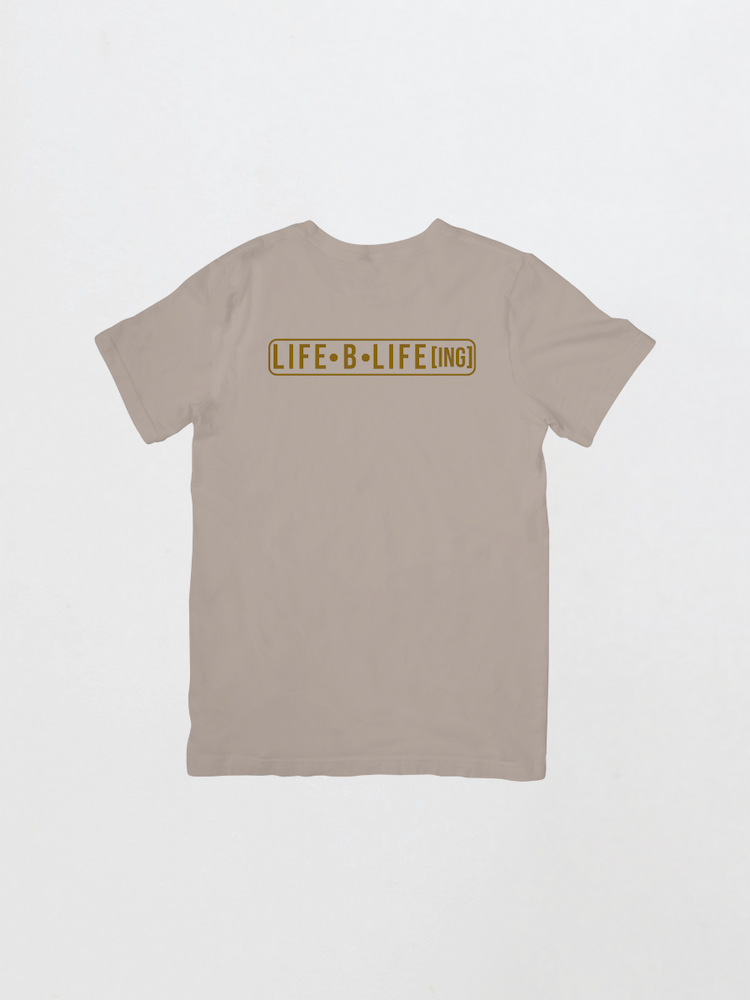 Beige t-shirt with 'LIFE B LIFE LING' text on a light gray background